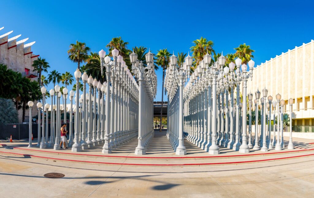 'Urban Light' - a large-scale assemblage sculpture by Chris Burden at the Los Angeles County Museum of Art. The installation consists of 202 restored street lamps by Aerial Film Studio.